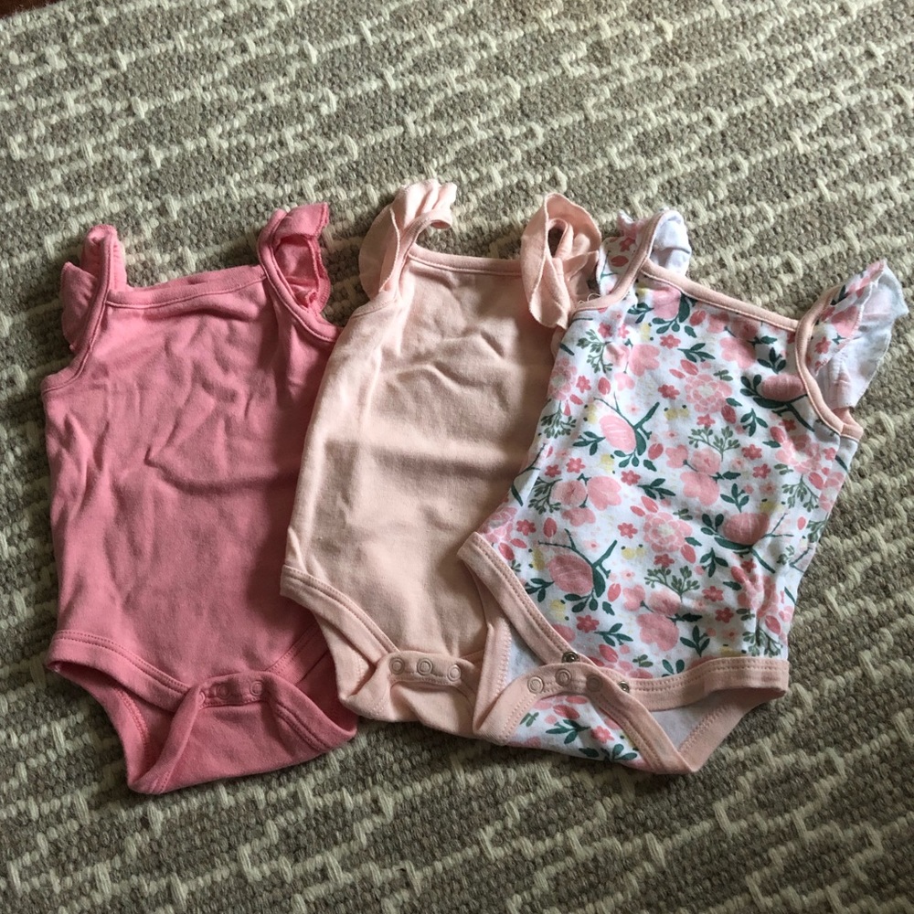 Never worn 3 pack baby girl onesies